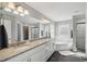 Spacious bathroom with double vanity, granite countertops, and soaking tub at 13227 Quigley Ave, Weeki Wachee, FL 34614