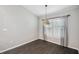 Dining area with modern light fixture and plantation shutters at 13227 Quigley Ave, Weeki Wachee, FL 34614