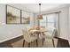 Cozy dining area featuring a round table, neutral decor, and natural lighting at 13227 Quigley Ave, Weeki Wachee, FL 34614
