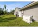 Side exterior view of house highlighting generator and HVAC at 13227 Quigley Ave, Weeki Wachee, FL 34614