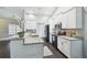 Bright kitchen showcasing granite countertops, stainless steel appliances, and a stylish backsplash at 13227 Quigley Ave, Weeki Wachee, FL 34614