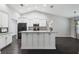 Modern kitchen featuring a large island, granite countertops, and stainless steel appliances at 13227 Quigley Ave, Weeki Wachee, FL 34614