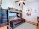 Bedroom featuring a bunk bed with striped linens and a compass rose decoration at 1445 Stonehenge Way, Palm Harbor, FL 34683