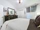 Bedroom featuring a large dresser, nautical decor, and a patterned duvet cover at 1445 Stonehenge Way, Palm Harbor, FL 34683