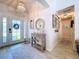 Bright foyer featuring stylish decor, tiled floors, and an inviting entryway at 1445 Stonehenge Way, Palm Harbor, FL 34683