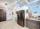Spacious kitchen featuring stainless steel appliances and an adjacent dining area at 1445 Stonehenge Way, Palm Harbor, FL 34683