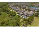 Aerial view showcasing the back of homes with pools surrounded by lush landscaping in an attractive neighborhood at 14855 Renaissance Ave, Odessa, FL 33556
