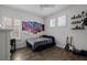 Bedroom featuring dark wood floors, ceiling fan, and decor on shelves at 14855 Renaissance Ave, Odessa, FL 33556