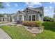 Charming two-story home showcasing a two car garage, brick driveway, and manicured landscaping at 14855 Renaissance Ave, Odessa, FL 33556