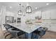 Bright kitchen boasts modern appliances, granite countertops, a large island and pendant lighting at 14855 Renaissance Ave, Odessa, FL 33556