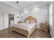 Serene main bedroom with wood floors, natural light, and ensuite bathroom access at 14855 Renaissance Ave, Odessa, FL 33556
