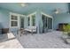 Outdoor seating area with furniture, with light blue walls, and large windows at 14855 Renaissance Ave, Odessa, FL 33556