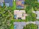 An aerial view of a private luxury home with a pool, solar panels and lush landscaping at 15110 Kestrelglen Way, Lithia, FL 33547