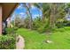 Expansive backyard featuring lush landscaping and a peaceful setting at 15110 Kestrelglen Way, Lithia, FL 33547