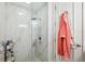 Modern bathroom with sleek, glass-enclosed shower, and neutral tile at 15110 Kestrelglen Way, Lithia, FL 33547