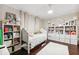 Charming bedroom with hardwood floors, built-in shelving, and a bright, airy feel at 15110 Kestrelglen Way, Lithia, FL 33547