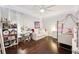 Cozy bedroom with soft lighting and built-in shelves for ample storage and decor at 15110 Kestrelglen Way, Lithia, FL 33547
