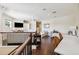 Bright bonus room with beautiful hardwood floors, ceiling fan, and comfortable sitting areas at 15110 Kestrelglen Way, Lithia, FL 33547
