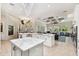 Open-concept kitchen with an island and stainless steel appliances at 15110 Kestrelglen Way, Lithia, FL 33547