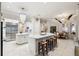 The modern kitchen features a large island with seating and stainless appliances at 15110 Kestrelglen Way, Lithia, FL 33547