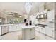 Gourmet kitchen showcasing a large island, stainless steel appliances, and an open layout at 15110 Kestrelglen Way, Lithia, FL 33547