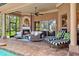 Beautiful lanai with cozy seating, a fireplace, and views of the private backyard and pool area at 15110 Kestrelglen Way, Lithia, FL 33547