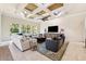 Spacious living room features a decorative ceiling and an open concept layout at 15110 Kestrelglen Way, Lithia, FL 33547