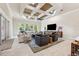 Spacious living room features a decorative ceiling and an open concept layout at 15110 Kestrelglen Way, Lithia, FL 33547