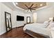 Spacious main bedroom with hardwood floors, trey ceilings, and access to sitting area at 15110 Kestrelglen Way, Lithia, FL 33547