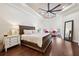 Main bedroom features a tray ceiling, hardwood floors, and a cozy sitting area at 15110 Kestrelglen Way, Lithia, FL 33547