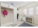 Well-designed mudroom area with a bench, storage, laundry room access, and natural light from the windows at 15110 Kestrelglen Way, Lithia, FL 33547