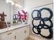 Stylish powder room with modern fixtures, marble countertop, and designer accents at 15110 Kestrelglen Way, Lithia, FL 33547