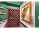 A charming wine cellar with a unique banana leaf stained glass feature at 15110 Kestrelglen Way, Lithia, FL 33547