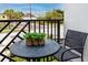 Cozy balcony with black metal furniture and green potted plant, perfect for outdoor relaxation at 1529 N Morgan St, Tampa, FL 33602
