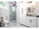 Modern bathroom featuring marble tile, sleek vanity, and glass-enclosed shower at 1529 N Morgan St, Tampa, FL 33602