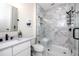 A modern bathroom featuring a marble glass shower, sink with a white vanity, and a toilet at 1529 N Morgan St, Tampa, FL 33602