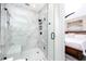 Modern bathroom featuring marble tiling, glass shower, bench, and black fixtures at 1529 N Morgan St, Tampa, FL 33602