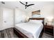 Cozy bedroom with a ceiling fan, closet, and dark wood furniture for a relaxing retreat at 1529 N Morgan St, Tampa, FL 33602