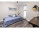 Comfortable bedroom featuring hardwood floors and natural light at 1529 N Morgan St, Tampa, FL 33602