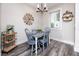 Charming dining area with rustic table, decor, stylish chandelier and natural light at 1529 N Morgan St, Tampa, FL 33602