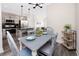 Dining area with modern kitchen, stainless steel appliances, and dining table in background at 1529 N Morgan St, Tampa, FL 33602