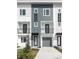 Modern townhome showcases a stylish facade with a private balcony and attached garage at 1529 N Morgan St, Tampa, FL 33602