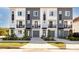 Modern townhomes featuring neutral exteriors, balconies and well-manicured landscaping at 1529 N Morgan St, Tampa, FL 33602