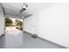 A clean and organized two-car garage featuring an automatic door opener and internal access door at 1529 N Morgan St, Tampa, FL 33602
