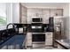 Contemporary kitchen with granite countertops, modern appliances, and sleek cabinetry at 1529 N Morgan St, Tampa, FL 33602