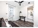 Comfortable sitting area with hardwood floors and access to a tiled bathroom at 1529 N Morgan St, Tampa, FL 33602