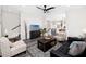 Open concept living area with hardwood floors, stairs, and living room furniture at 1529 N Morgan St, Tampa, FL 33602