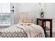 Living room chair with throw blanket and pillow; accent table with floral decor at 1529 N Morgan St, Tampa, FL 33602