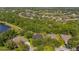 A beautiful home nestled in a lush, wooded neighborhood with a private backyard pool and serene surroundings at 15934 Sorawater Dr, Lithia, FL 33547