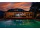 Backyard pool with water features reflecting the outdoor living space that features a built in grill at 15934 Sorawater Dr, Lithia, FL 33547